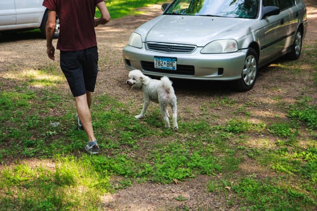 Elliot in front of the car